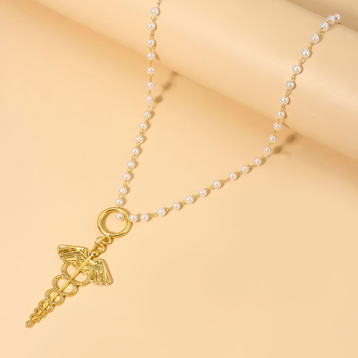 

Wing Design Pendant Necklace, Gold