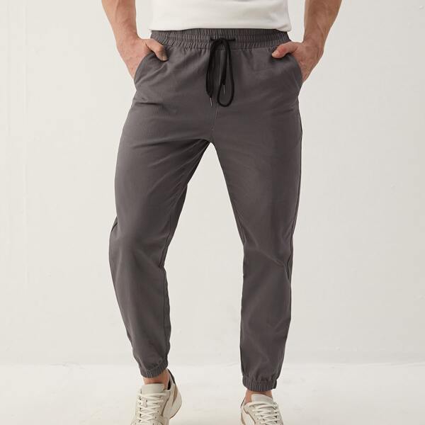 

Men Solid Carrot Pants, Grey