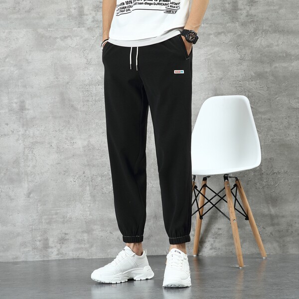 

Men Letter Patched Drawstring Carrot Pants, Black