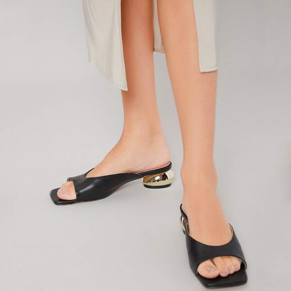 

SCULPTURAL HEELED MULES, Black