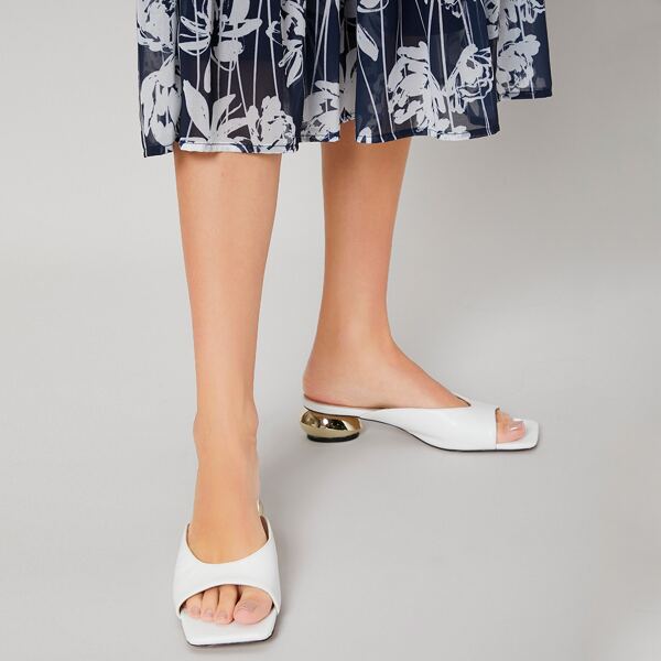 

SCULPTURAL HEELED MULES, White