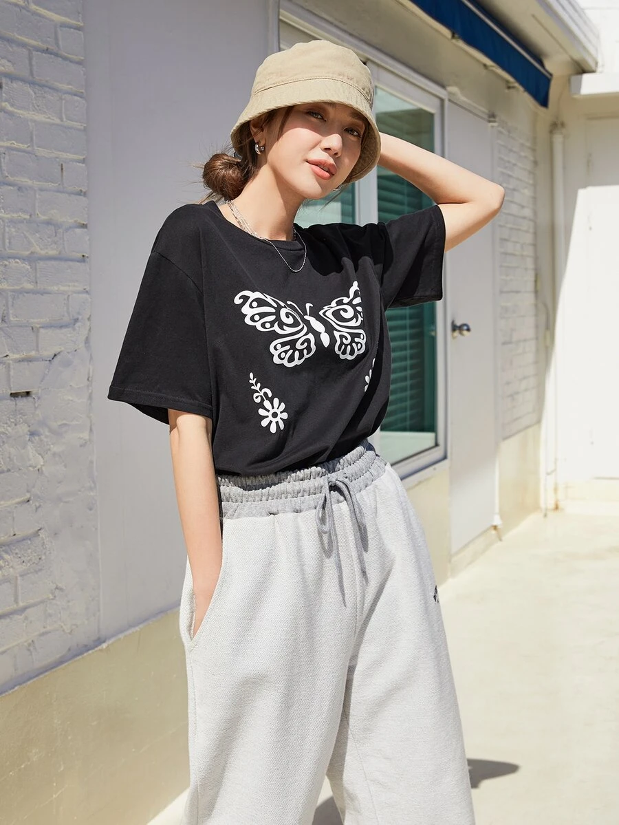 DAZY Camiseta de hombros caídos con estampado de mariposa - Negro - Ver 1