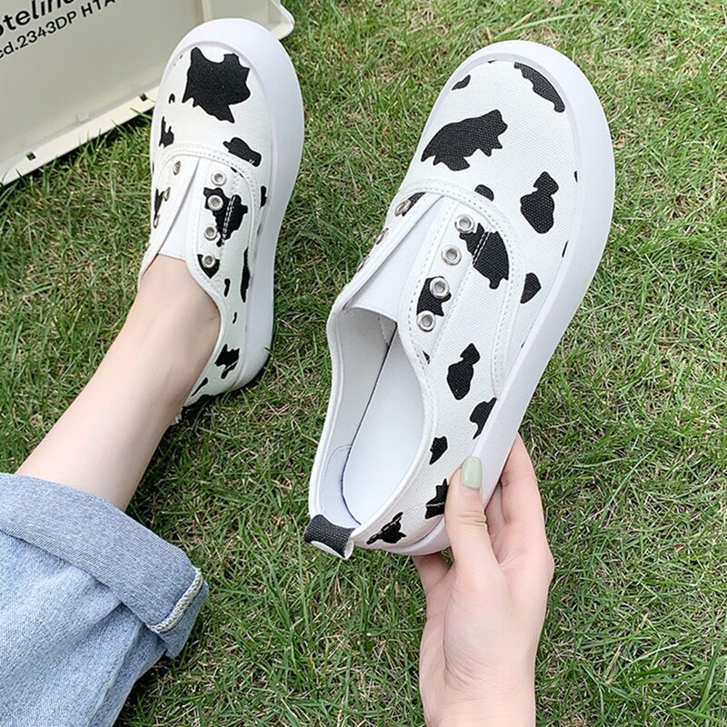 

Cow Print Slip On Canvas Sneakers, Black and white