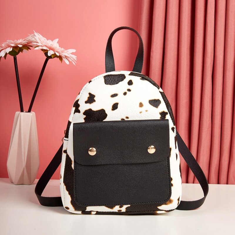 

Cow Pattern Pocket Front Backpack, Black and white