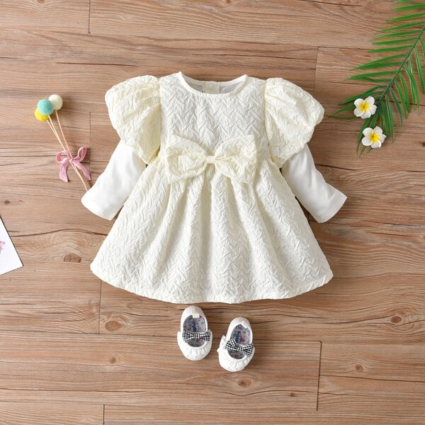 

Baby Girl Bow Front Babydoll Dress, Beige