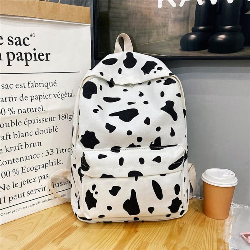 

Cow Pattern Pocket Front Backpack, Black and white
