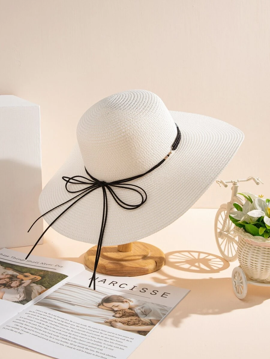 Sombrero de paja con diseño de lazo