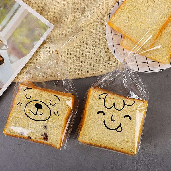 

50pcs Cartoon Graphic Random Packaging Bag, Clear