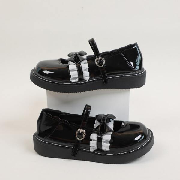 

Ruffle & Bow Decor Mary Jane Flats, Black