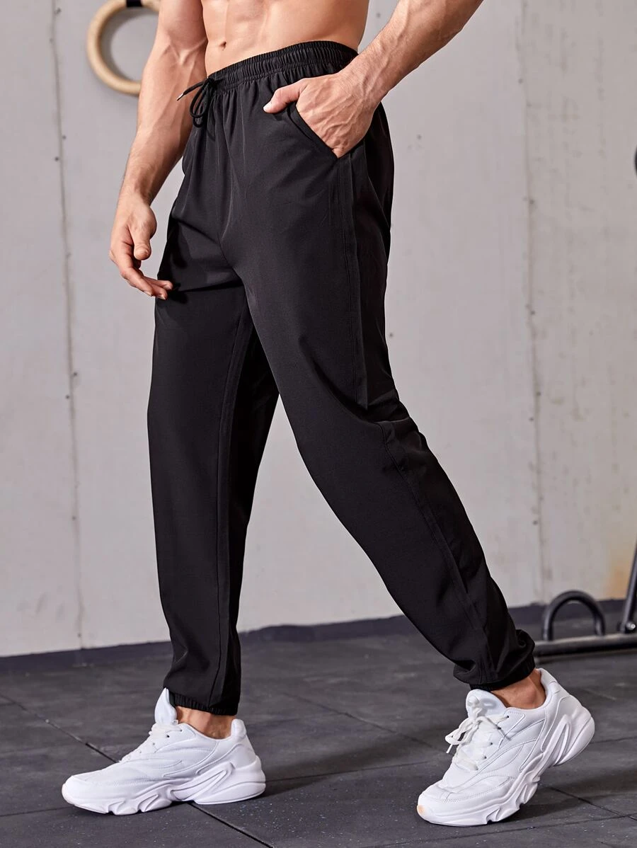 Manfinity Sport Streetwear Men Drawstring Waist Solid Sport Trousers - Black - View 1