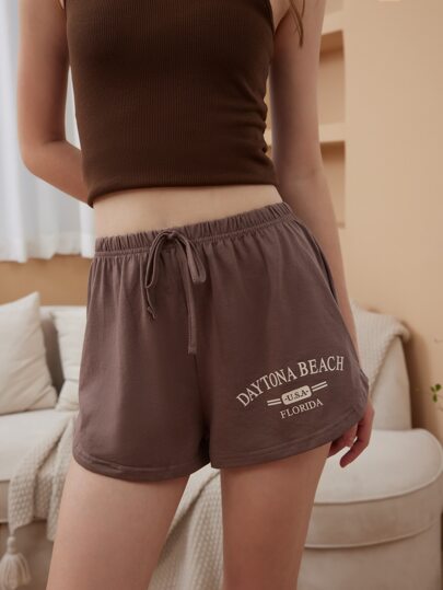 شورت تريك معقود امامي وبجرافيك عبارة