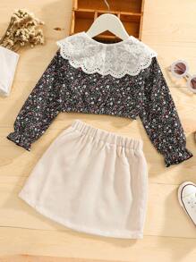 年輕女孩花卉圖案立領泡泡袖上衣和裙子