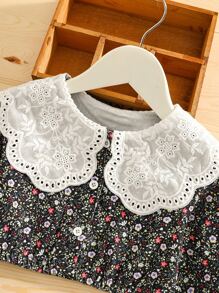 年輕女孩花卉圖案立領泡泡袖上衣和裙子