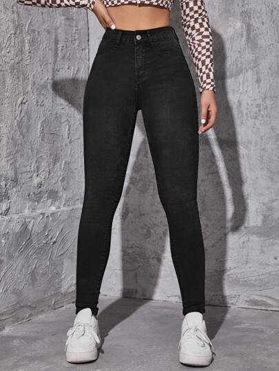 Jeans ajustados con lavado oscuro