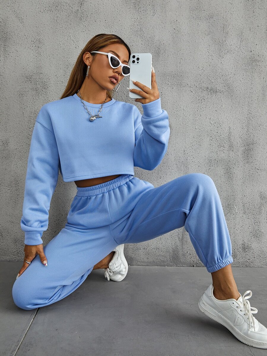 SHEIN MOOSTA Pullover de hombros caídos con pantalones deportivos con bolsillos oblicuos - Celeste - Ver 1