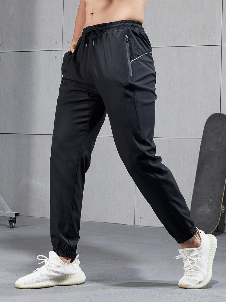 Manfinity Fitness Boyfriend Style Men Solid Zip Pocket Sport Pants Sweat-Wicking Lightweight Comfortable Running Muscle Minimalist Design Slim Fit For Workout Gymwear Sweat Pants - Black - View 1