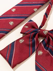 2 件套女士校服风格服装，配有百搭皇冠领带配饰