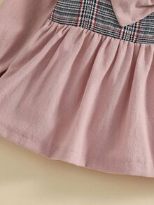 小女童格紋前蝴蝶結荷葉袖上衣和緊身打底褲