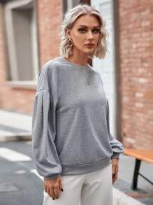 Sudadera unicolor de hombros caídos