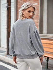 Sudadera unicolor de hombros caídos