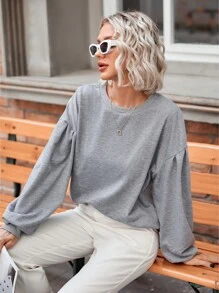 Sudadera unicolor de hombros caídos