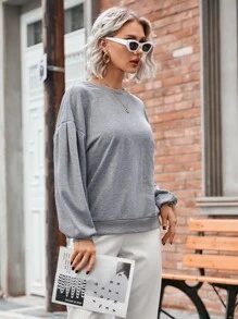 Sudadera unicolor de hombros caídos