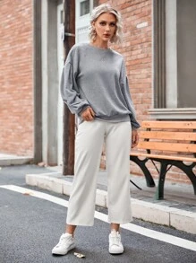 Sudadera unicolor de hombros caídos