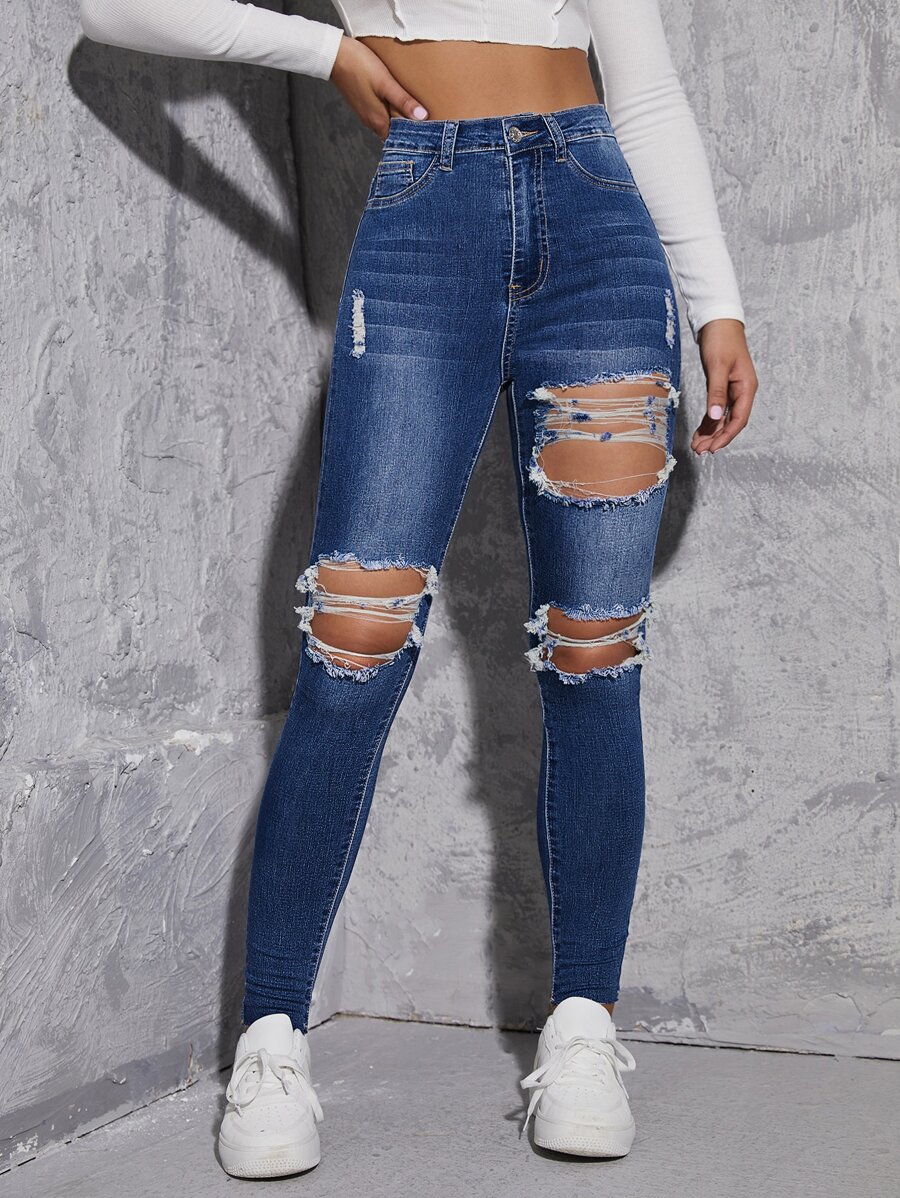 Jeans ajustados de talle alto roto con abertura - Azul lavado medio - Ver 1