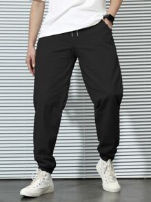 Manfinity 寬鬆剪裁男士側口袋胡蘿蔔褲,帶有彈性收口 - 黑色 - 查看 1