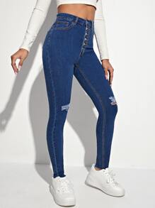 Jeans ajustados desgarro con botón