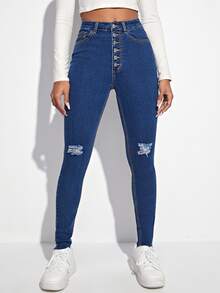 Jeans ajustados desgarro con botón