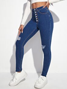 Jeans ajustados desgarro con botón