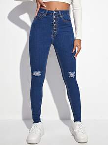 Jeans ajustados desgarro con botón