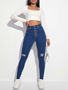 Jeans ajustados desgarro con botón