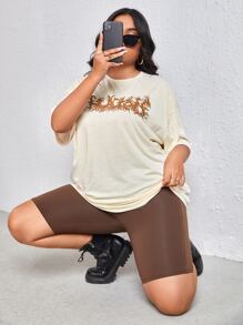 Flirla プラス グラフィックプリント ドロップショルダーTシャツ