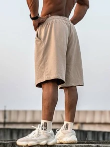Manfinity Hypemode Pantaloncini larghi da uomo con vita con coulisse, gamba ampia, tinta unita color cachi, adatti per il ritorno a scuola
