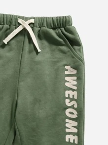 SHEIN Toddler Boys Dinosaur Print Top & Letter Graphic Joggers