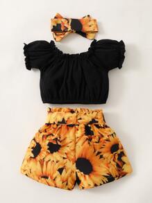 女婴褶邊上衣和花卉短褲和髮帶