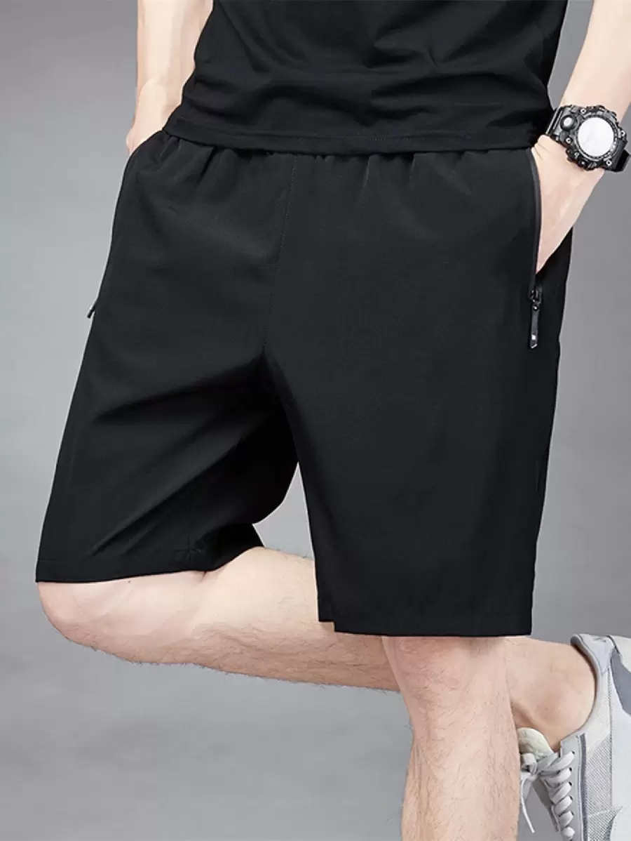 Manfinity Hypemode Hombres Shorts vestir negro básico liso con bolsillo con cremallera y cintura con cordón - Negro - Ver 1
