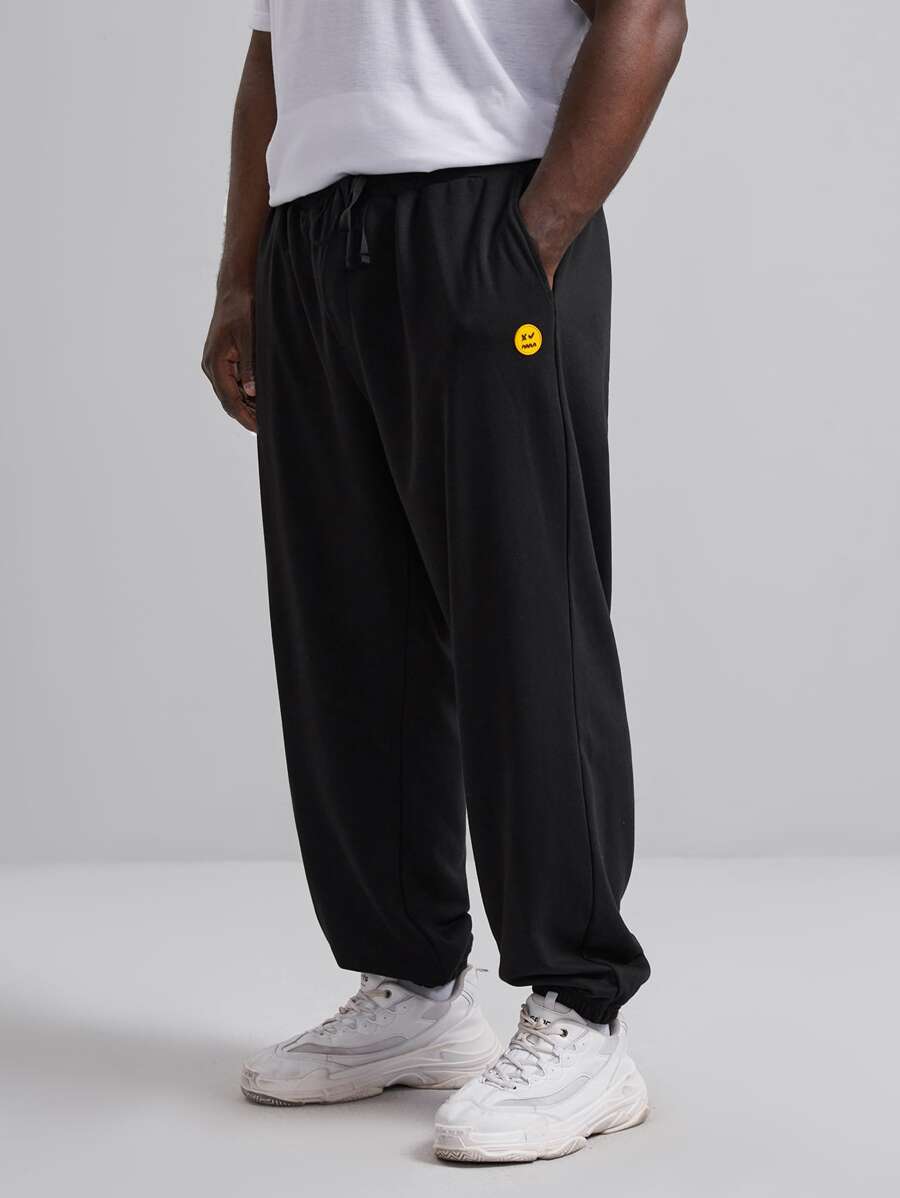 EASEVO Men Cartoon Face Patch Detail Tapered Joggers - Black - View 1