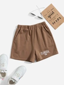 SHEIN 女孩字母圖案斜口袋短褲