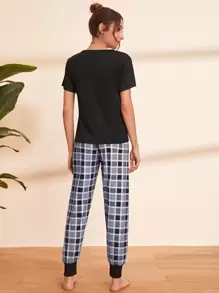 Conjunto de pijama camiseta con letra y dibujo con pantalones de cuadros - Multicolor - Ver 2