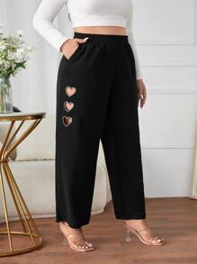 Pantalones de pierna ancha en forma de corazón con abertura