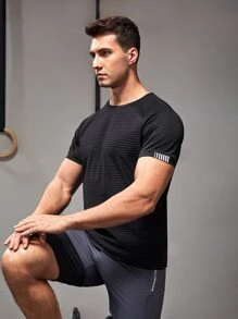 Manfinity Fitness Camiseta deportiva de manga raglán con detalle reflectante, estilo novio, para entrenamiento
