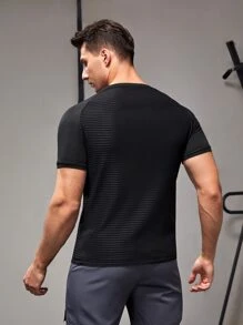 Manfinity Fitness Camiseta deportiva de manga raglán con detalle reflectante, estilo novio, para entrenamiento
