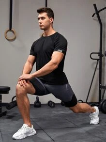 Manfinity Fitness Camiseta deportiva de manga raglán con detalle reflectante, estilo novio, para entrenamiento