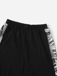 SHEIN Conjunto camiseta con estampado de arte pop de color combinado con shorts track - Blanco y Negro - Ver 4