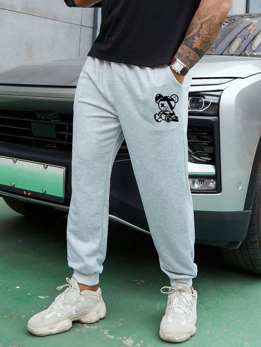 Manfinity Hombres Pantalones deportivos con estampado de dibujos animados - Gris Claro - Ver 1