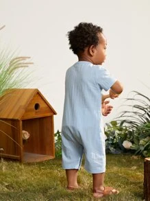 Baby Jumpsuit mit Knopf vorne, Absteppen