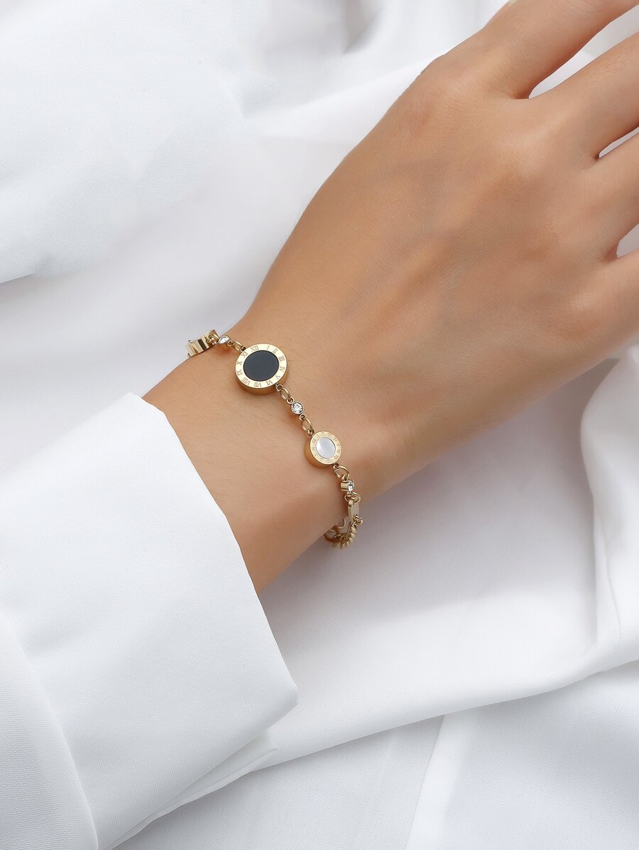 A European and American style Roman numerals black and white shell inlaid with diamonds fashion senior women's stainless steel bracelet suitable for daily wear